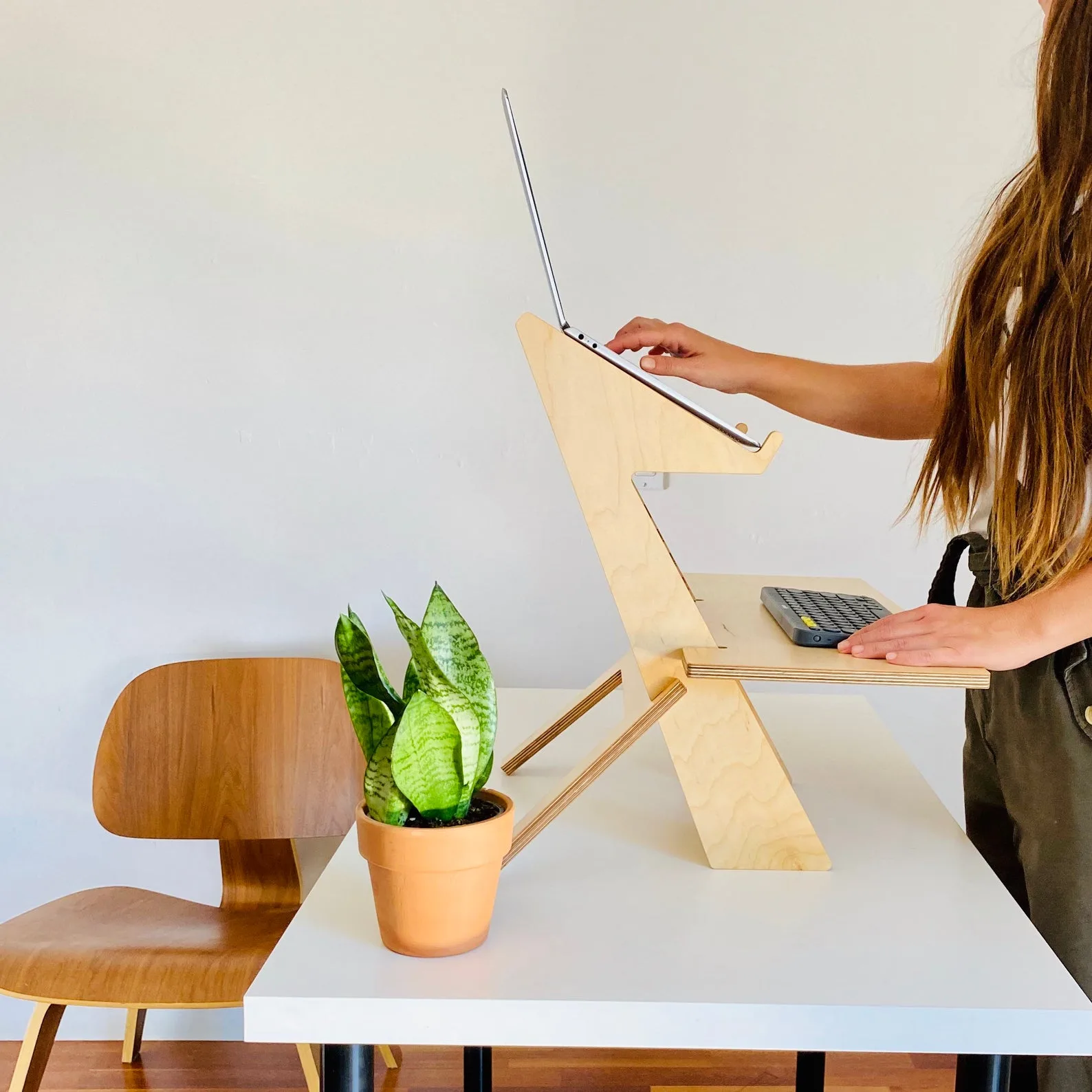 Ergonomic laptop accessories for work or study: The Curve laptop stand elevates your MacBook to a perfect 6.5 inches above your desk so it's at eye level